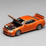 Motorhelix Nissan Skyline GT-R R34 V-Spec II Customized Metallic Orange 1:64 przód detal